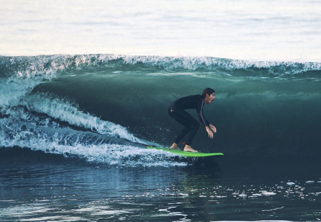 Expert surfing through barrel