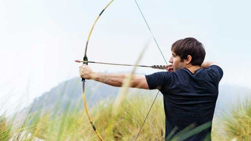 Hunter with handmade bow