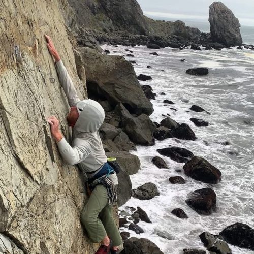 Rock climbing along sea